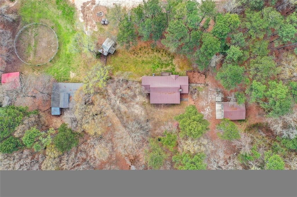 8345 Cleckler Road Palmetto, GA 30268 - Photo 40 of 41 an aerial view of a house with garden space and trees all around