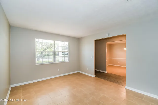 a view of an empty room with a window