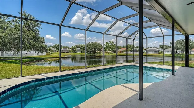 a view of a lake with houses in the back
