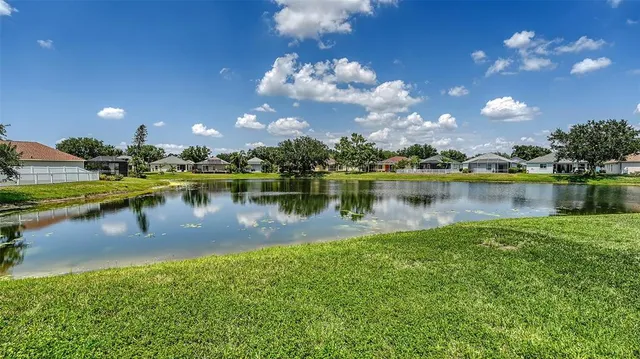 an aerial view of a residential houses with outdoor space and swimming pool