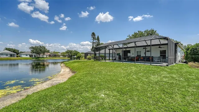an aerial view of a house with a lake view
