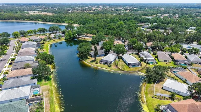 a view of a swimming pool with a yard