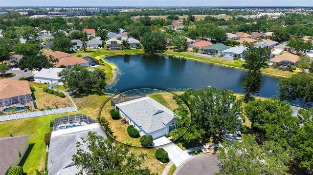 an aerial view of a house with a swimming pool yard and outdoor seating