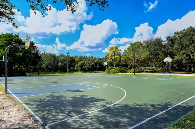 a view of a park with sitting area