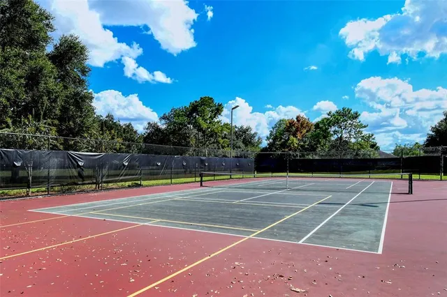a view of a wooden bench sitting in backyard