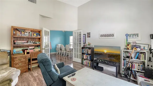 a view of a dining room with furniture and a window