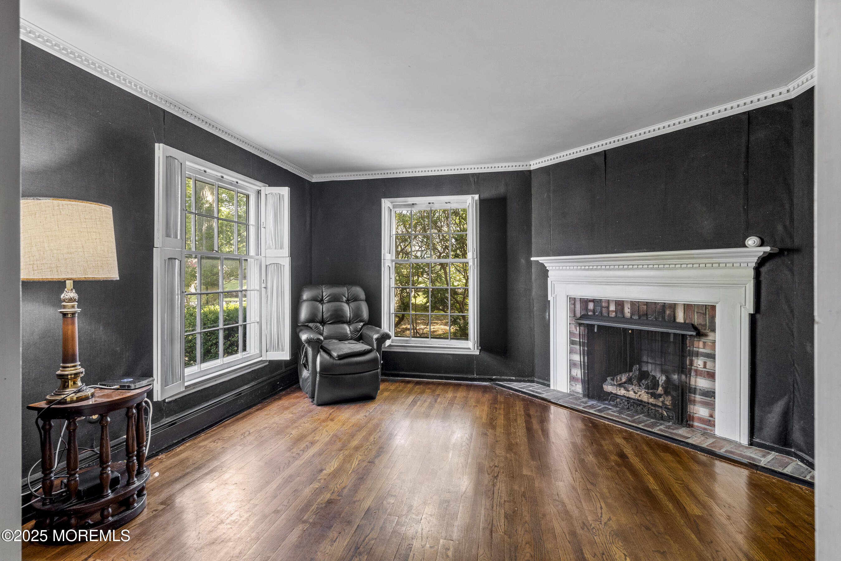 647 Valley Road Brielle, NJ 08730 - Photo 11 of 38 a living room with furniture and a fireplace