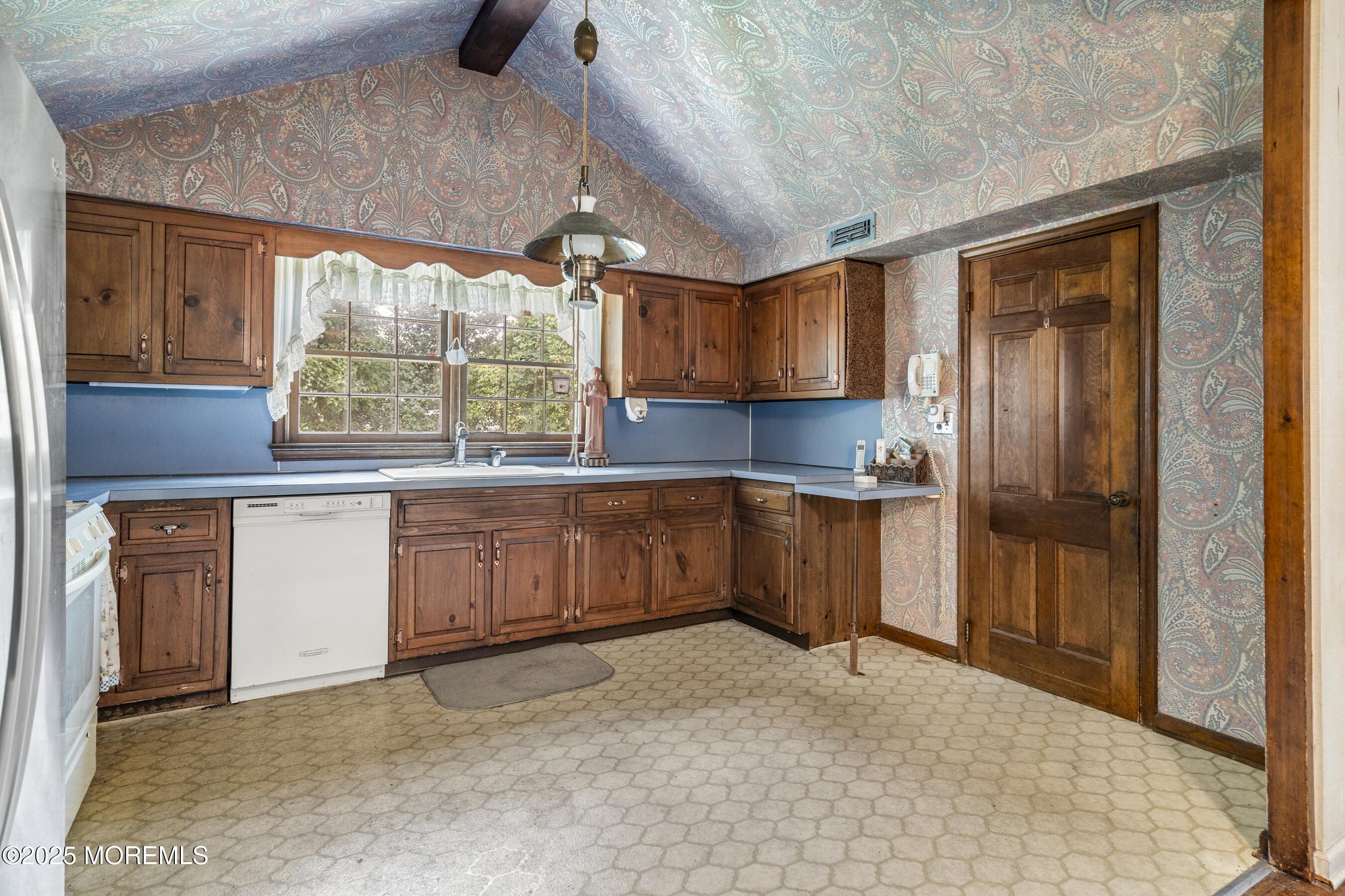 647 Valley Road Brielle, NJ 08730 - Photo 13 of 38 a kitchen with granite countertop a stove a sink and a refrigerator