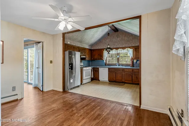 a view of a kitchen and a window