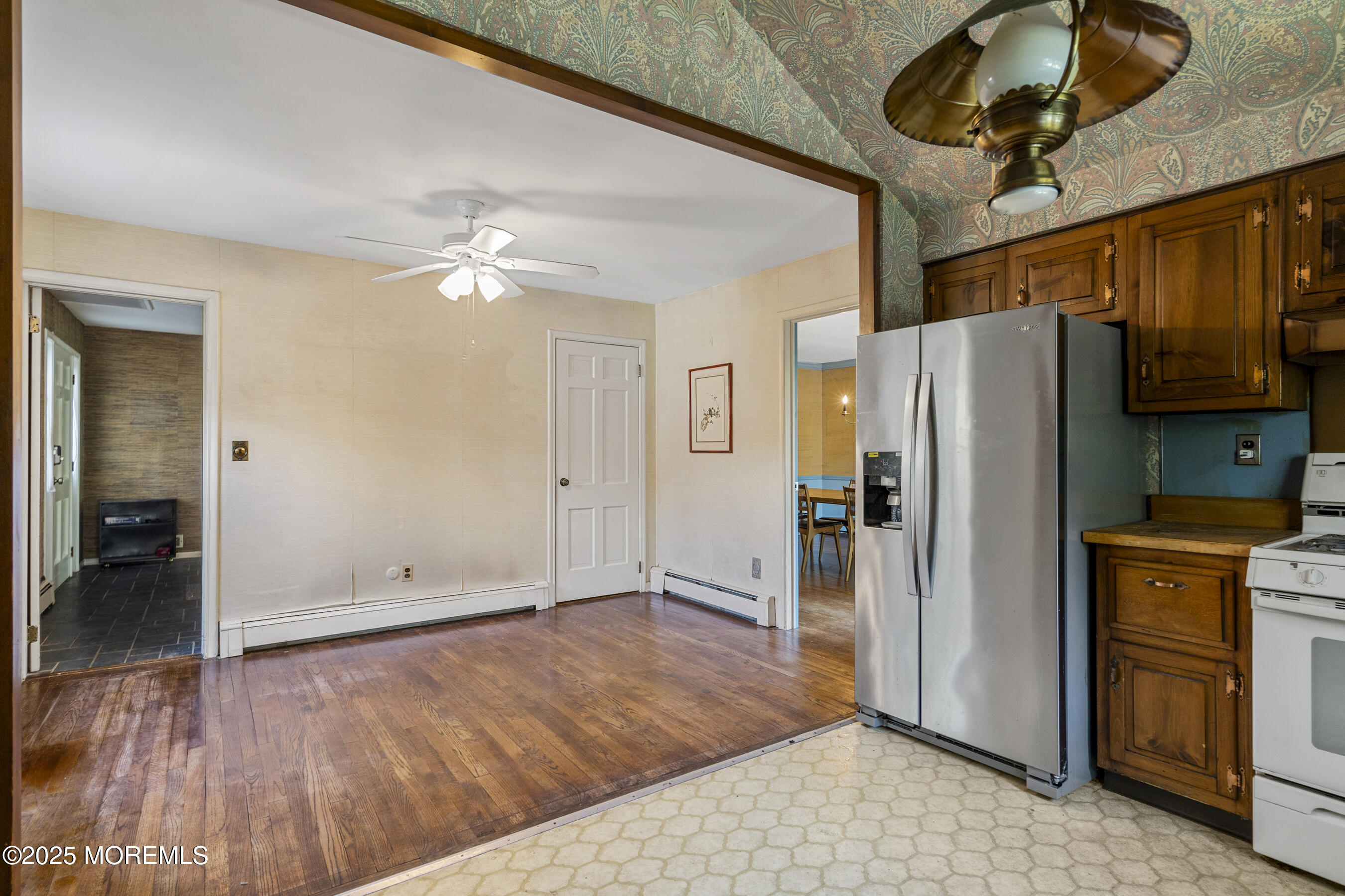 647 Valley Road Brielle, NJ 08730 - Photo 15 of 38 a view of a kitchen with a stove and a refrigerator