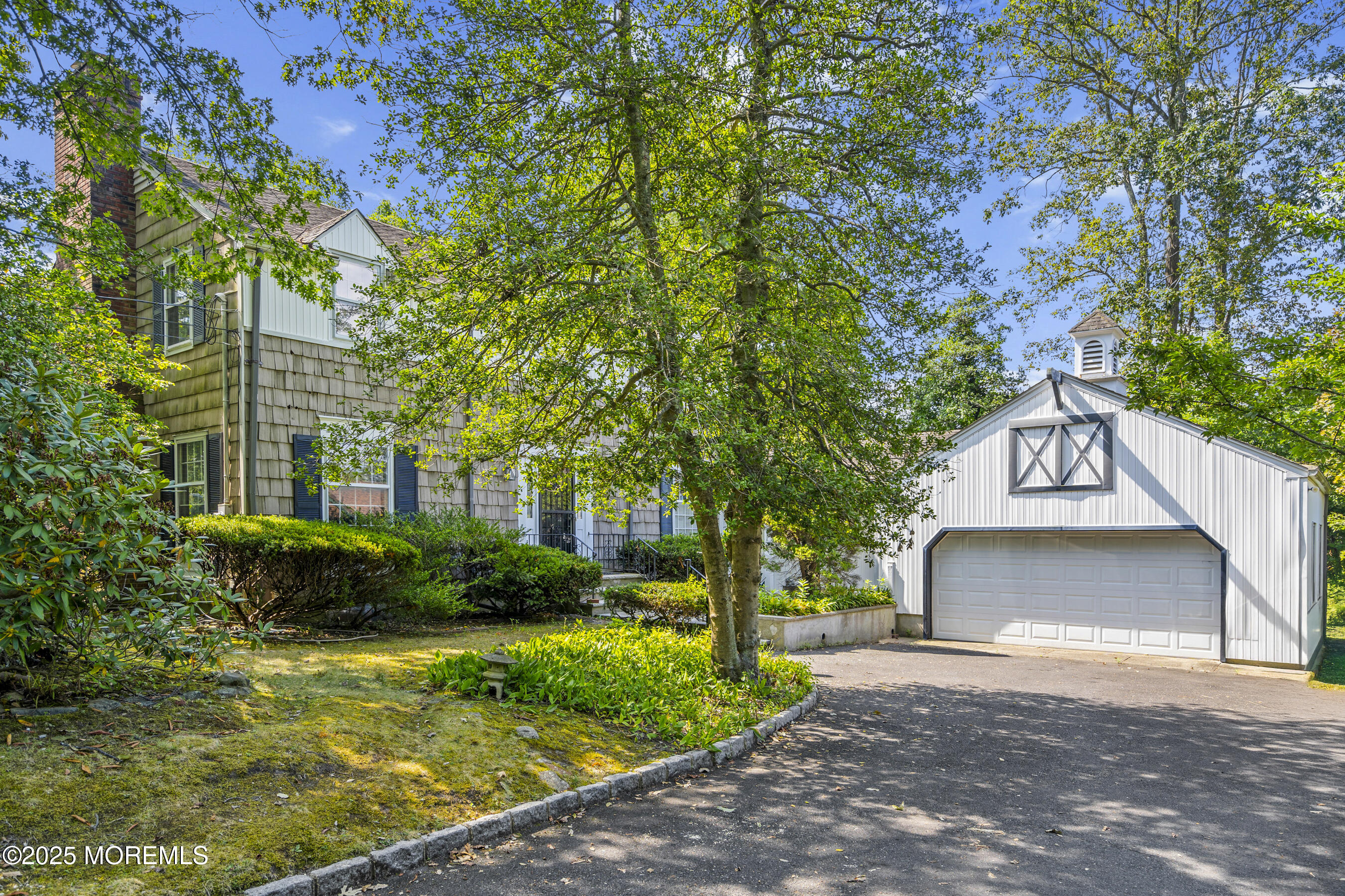 647 Valley Road Brielle, NJ 08730 - Photo 3 of 38 a front view of a house with garden