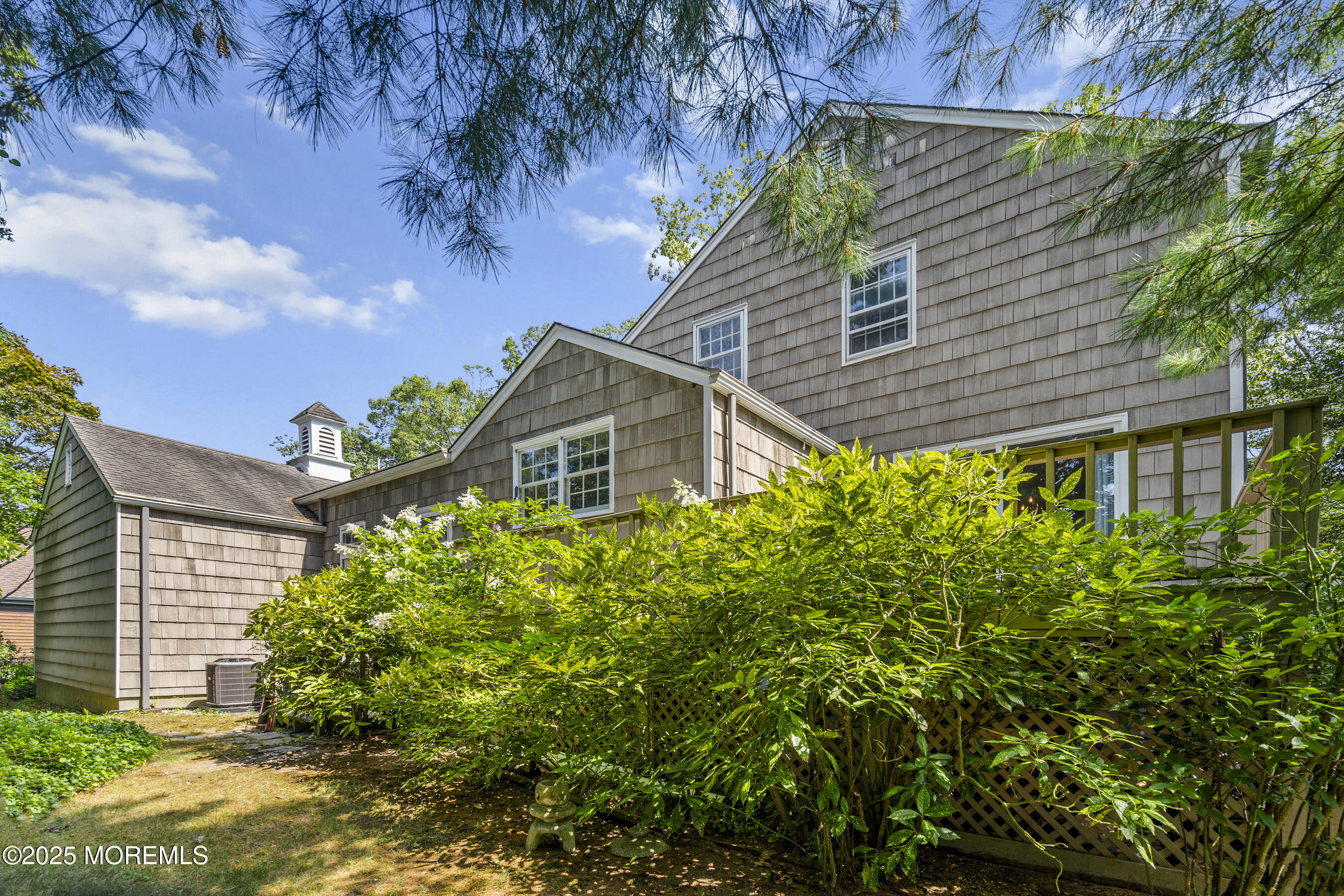 647 Valley Road Brielle, NJ 08730 - Photo 31 of 38 a front view of a house with garden