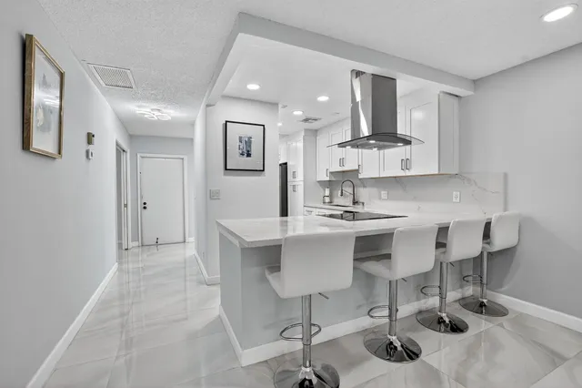 a kitchen with a sink cabinets and window