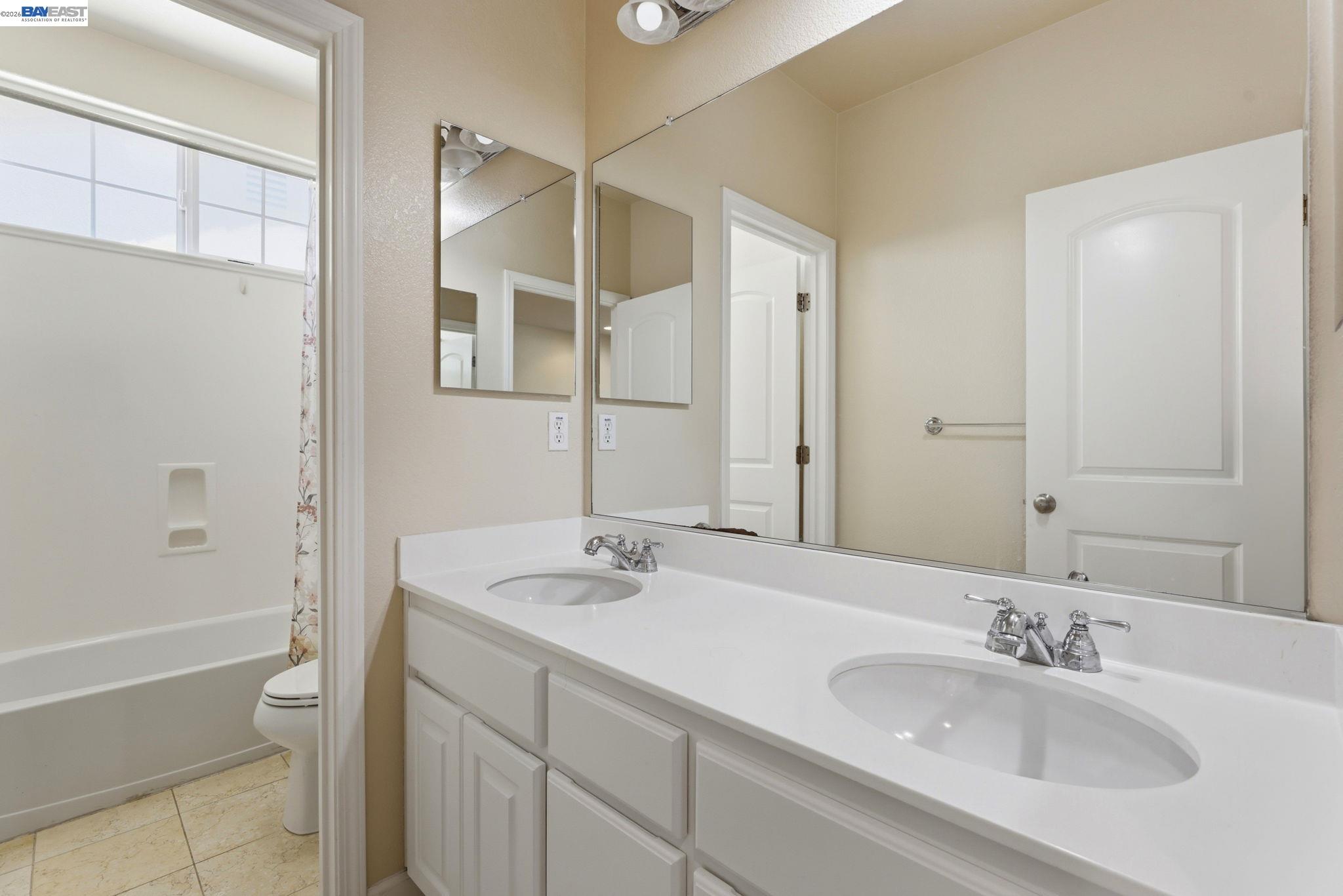 5029 Queensbury Way San Ramon, CA 94582 - Photo 31 of 58 a bathroom with a sink and a mirror