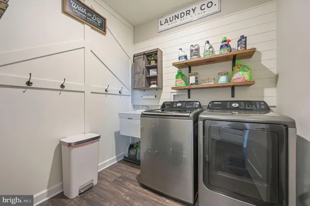 a utility room with washer and dryer