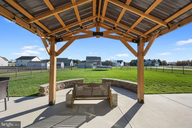 a patio with view of a backyard