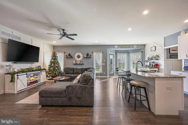 a living room with fireplace furniture and a flat screen tv