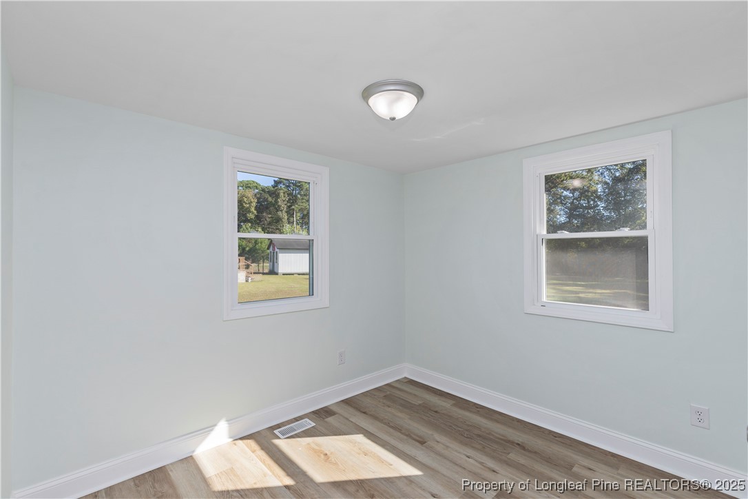 1340 George Perry Lee Road Dunn, NC 28334 - Photo 21 of 31 an empty room with a window