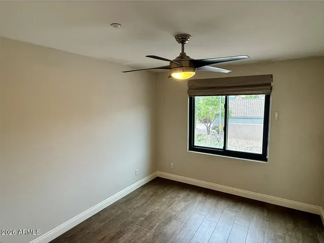 a view of a house with a big yard and sitting area