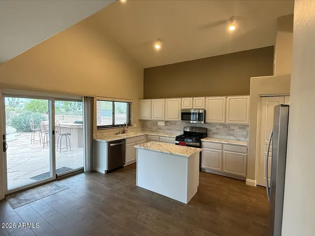 a view of room with hardwood floor and window
