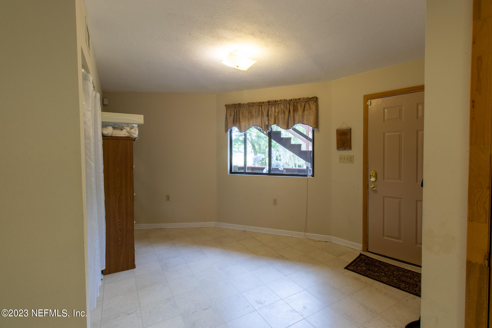 1151 Southeast 46th Loop Keystone Heights, FL 32656 - Photo 19 of 39 an empty room with windows