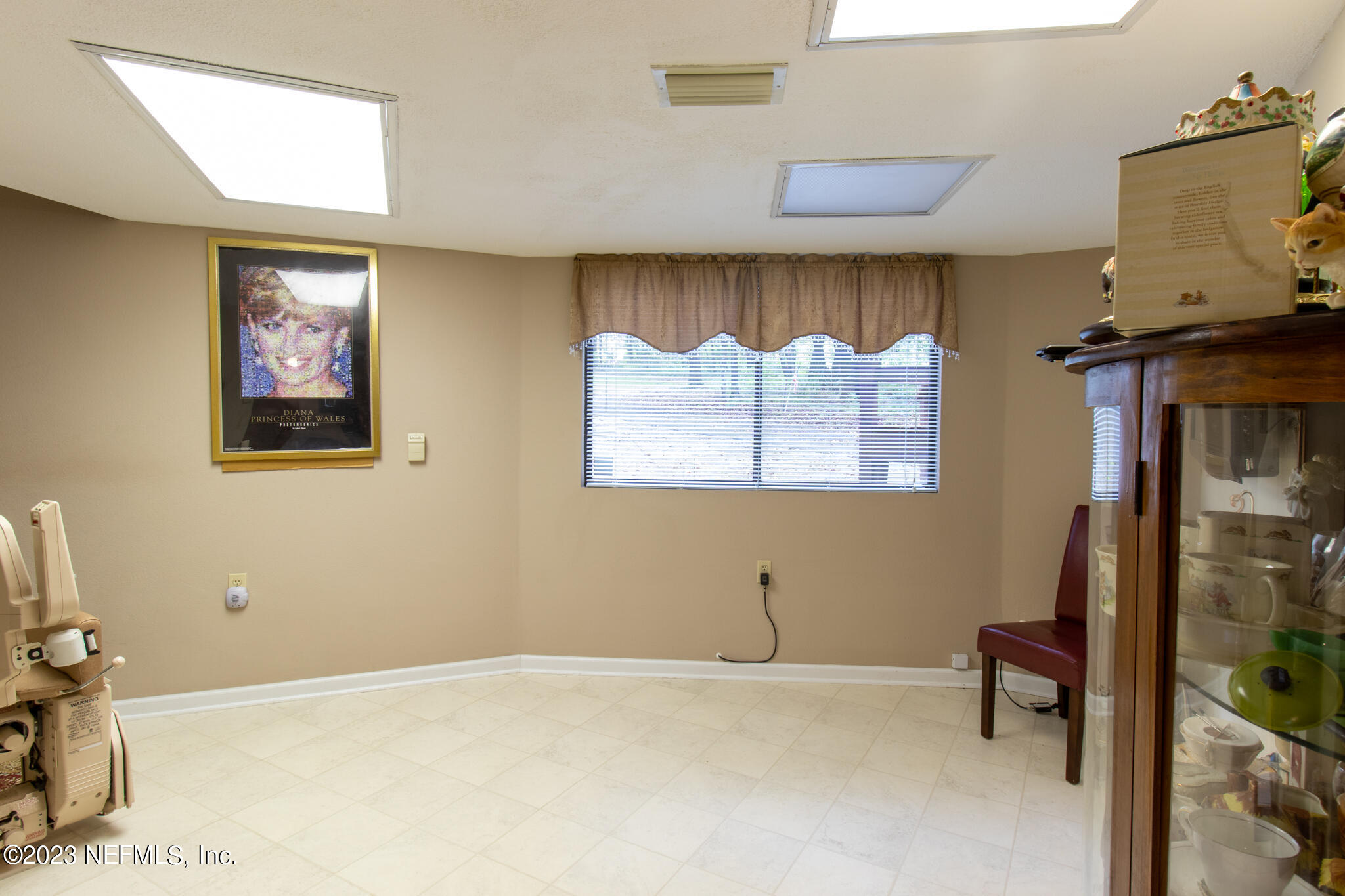 1151 Southeast 46th Loop Keystone Heights, FL 32656 - Photo 20 of 39 a view of room with a baby crib and a couch