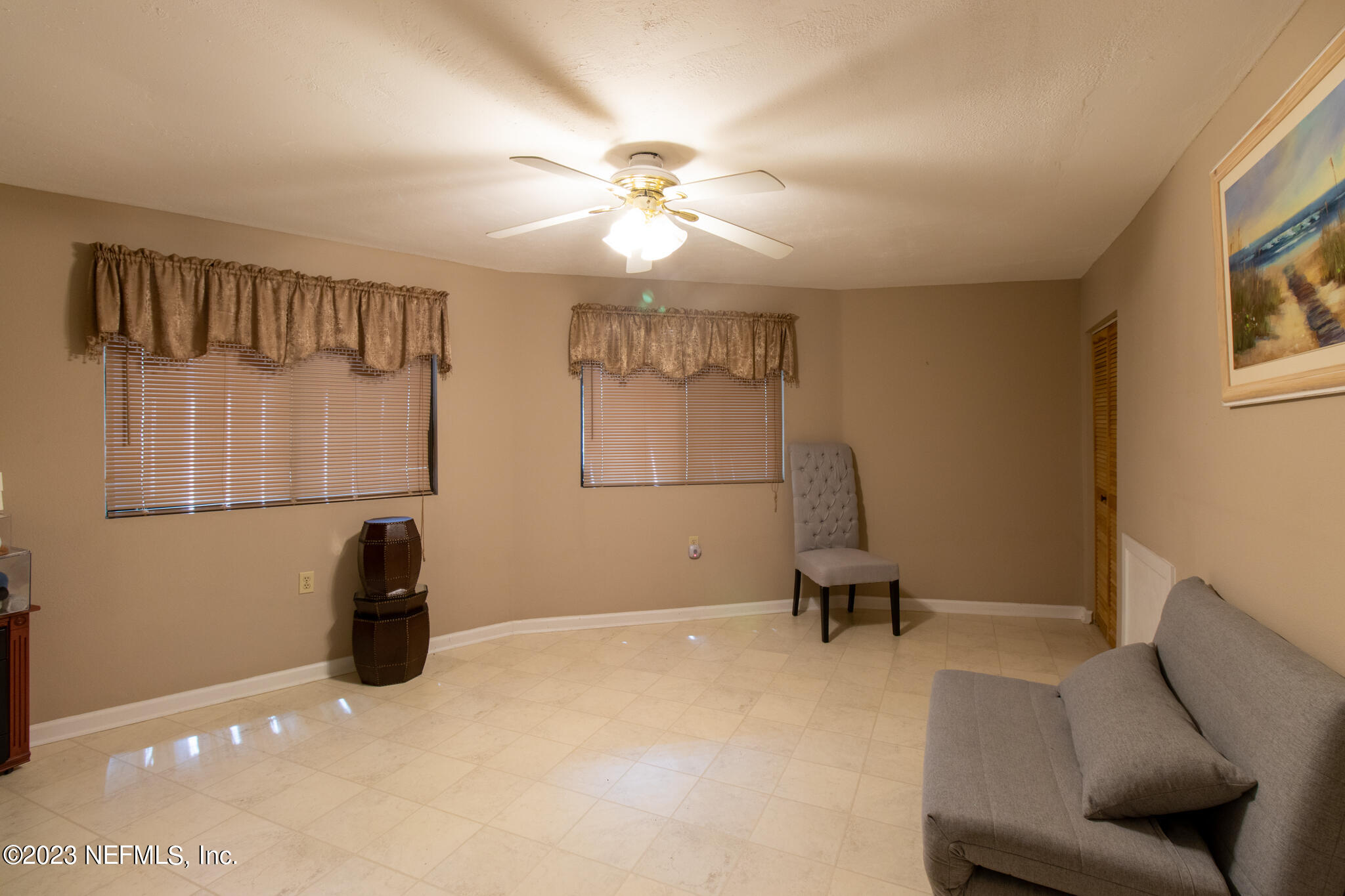 1151 Southeast 46th Loop Keystone Heights, FL 32656 - Photo 21 of 39 a bedroom with a bed and a window