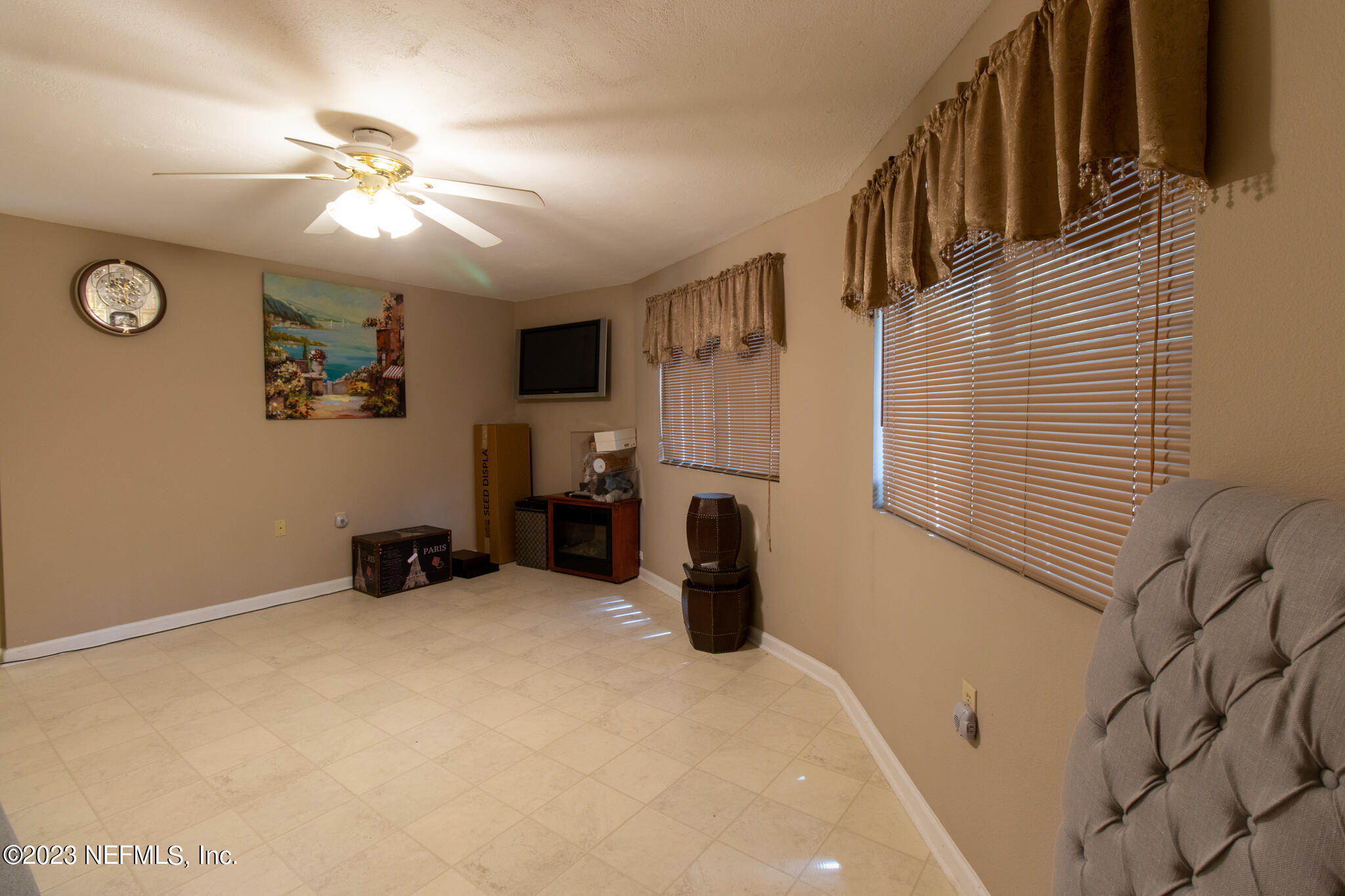 1151 Southeast 46th Loop Keystone Heights, FL 32656 - Photo 22 of 39 a view of a livingroom with furniture and a ceiling fan