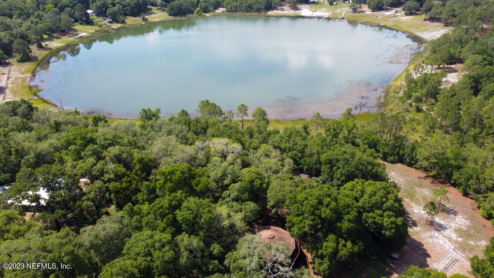 1151 Southeast 46th Loop Keystone Heights, FL 32656 - Photo 38 of 39 an aerial view of a houses with a lake view