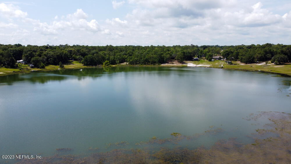 1151 Southeast 46th Loop Keystone Heights, FL 32656 - Photo 39 of 39 a view of a lake with houses in the back