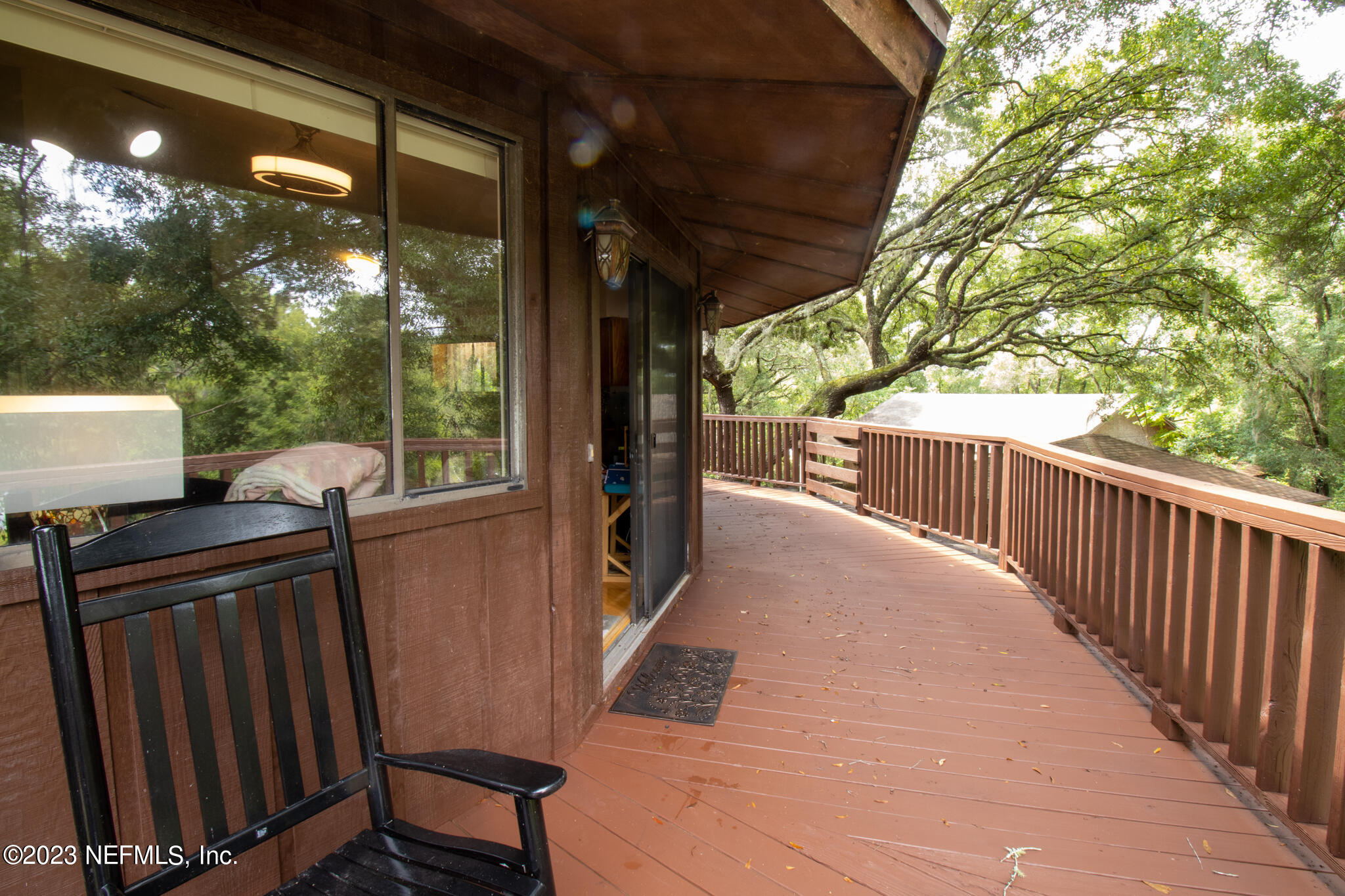 1151 Southeast 46th Loop Keystone Heights, FL 32656 - Photo 5 of 39 a view of a porch with wooden floor