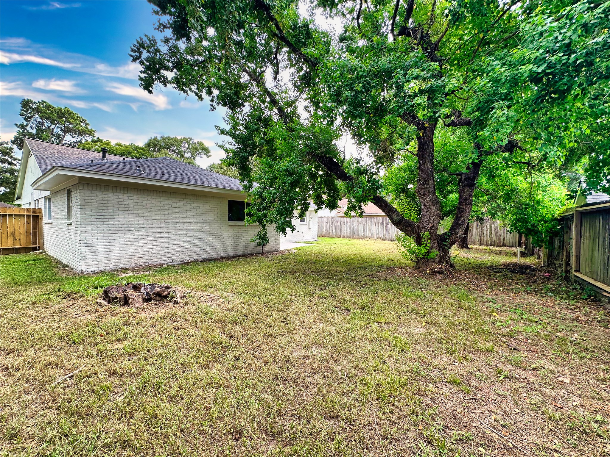 29310 Loddington Street Spring, TX 77386 - Photo 23 of 23 a backyard of a house with lots of green space