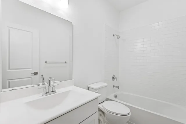 a view of hallway with wooden floor