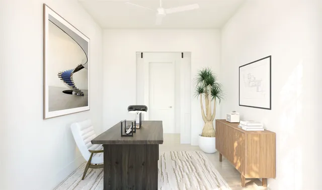 a living room with furniture and a potted plant