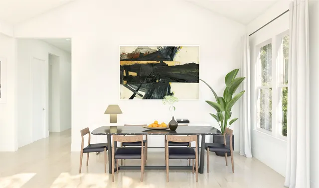 a view of a dining room with furniture and a potted plant