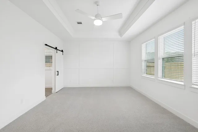 a bathroom with a double vanity sink a large mirror and shower