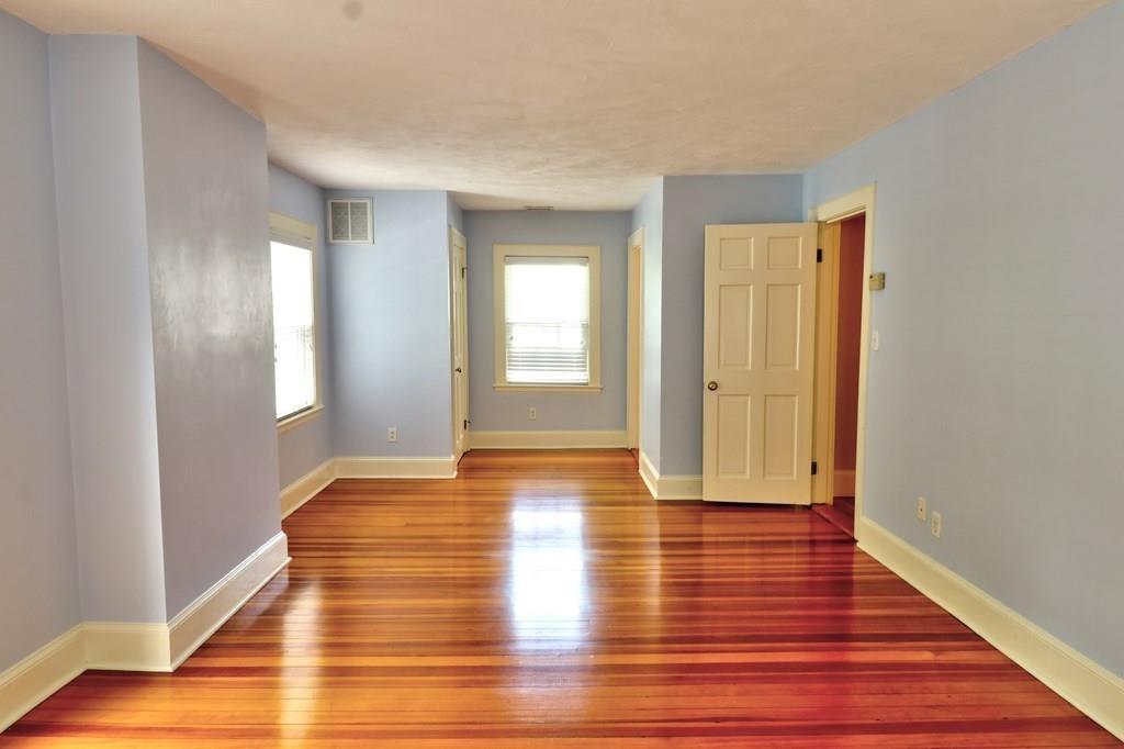 39 Priscilla Road Newton, MA 02467 - Photo 17 of 36 a view of an empty room with window and wooden floor