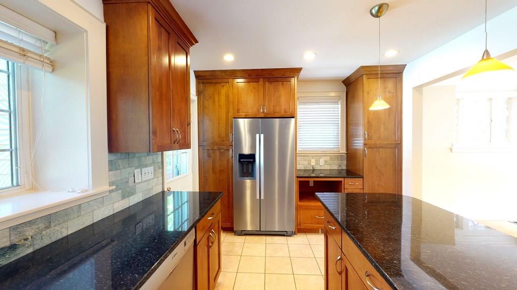 39 Priscilla Road Newton, MA 02467 - Photo 9 of 36 a kitchen with stainless steel appliances granite countertop a refrigerator a sink and a stove