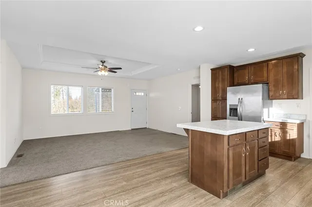 a view of a kitchen with a sink cabinets and wooden floor