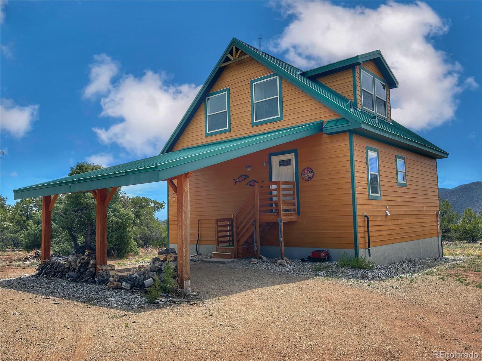 52601 County Rd LL56 Villa Grove, CO 81155 - Photo 1 of 33 a front view of a house with garden