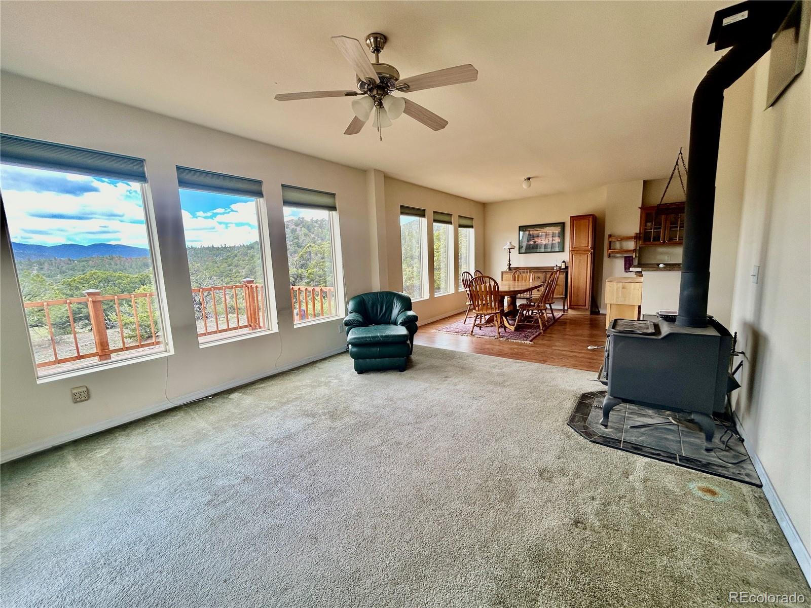 52601 County Rd LL56 Villa Grove, CO 81155 - Photo 4 of 33 a living room with furniture large window and flat screen tv