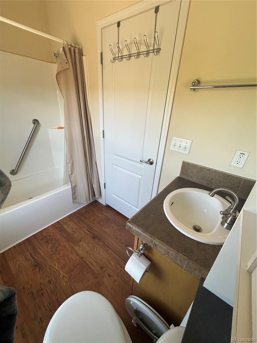 52601 County Rd LL56 Villa Grove, CO 81155 - Photo 8 of 33 a bathroom with a toilet sink and mirror