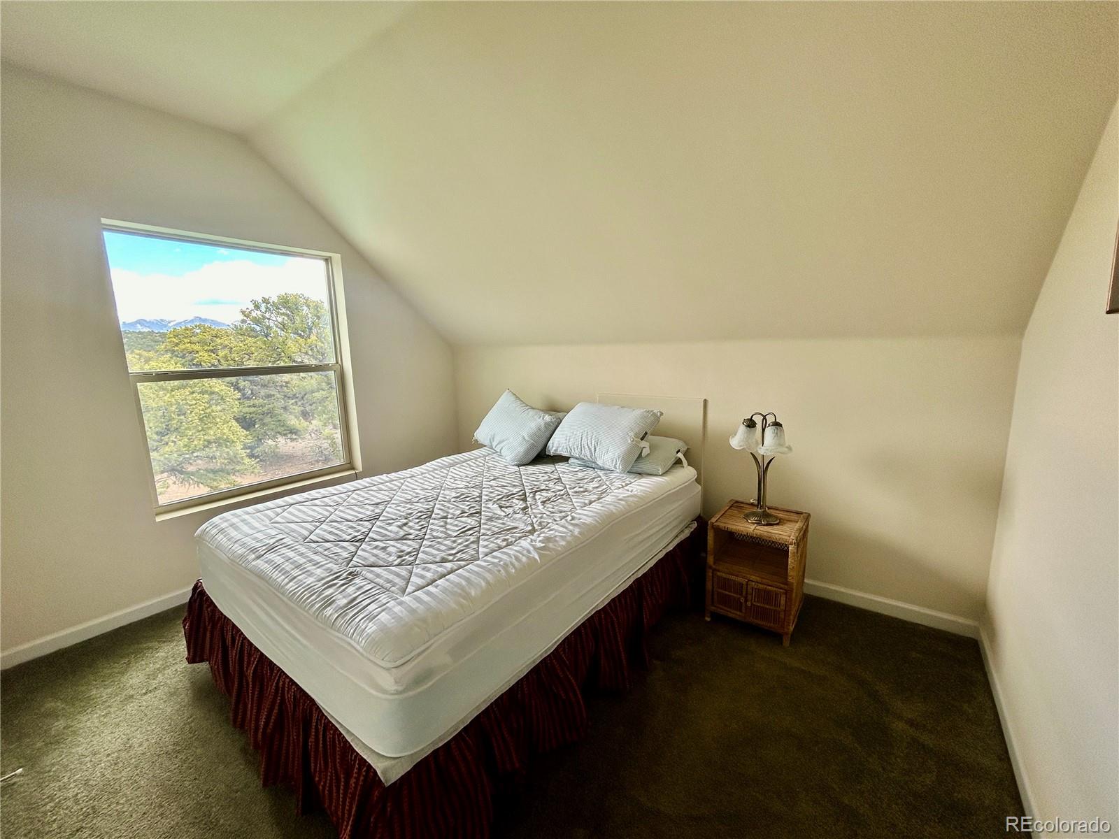 52601 County Rd LL56 Villa Grove, CO 81155 - Photo 10 of 33 a bedroom with a bed and window