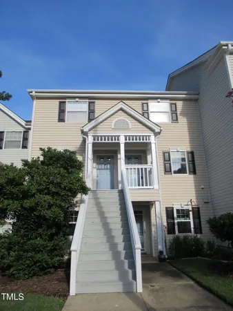 a front view of a house with yard