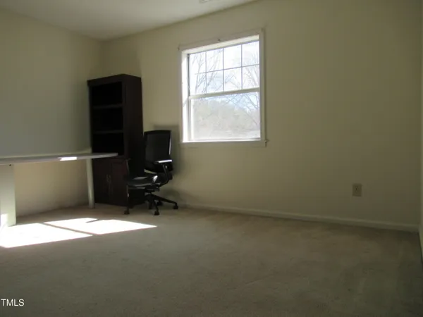a view of a workspace with furniture