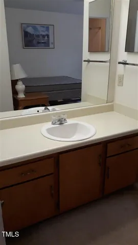 a close view of sink and cabinets