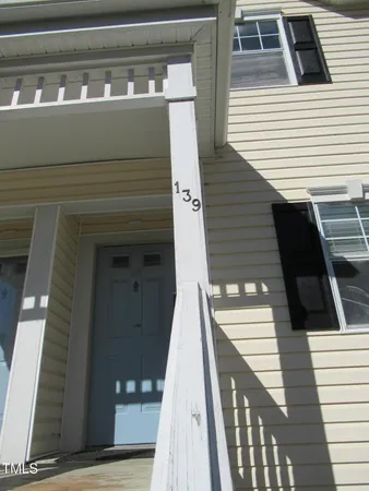 a view of a house with wooden stairs