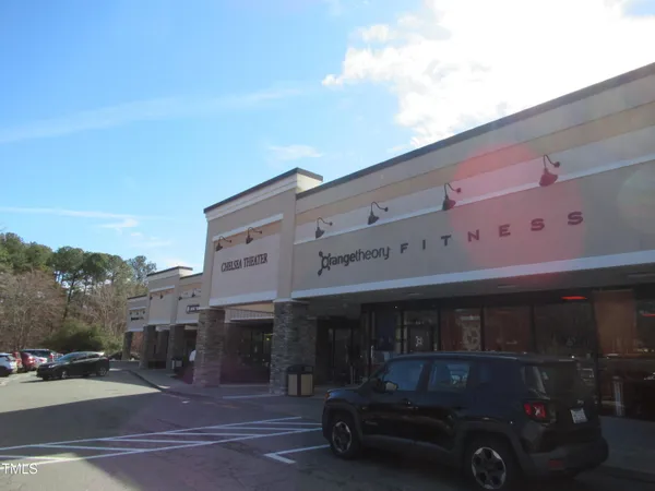a front view of a building with retail street