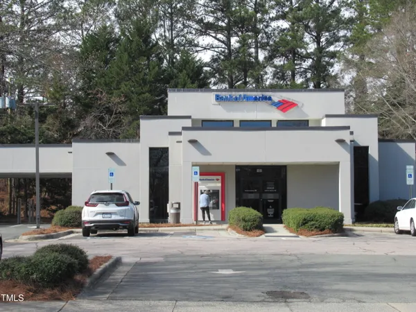 a front view of a building with sign board