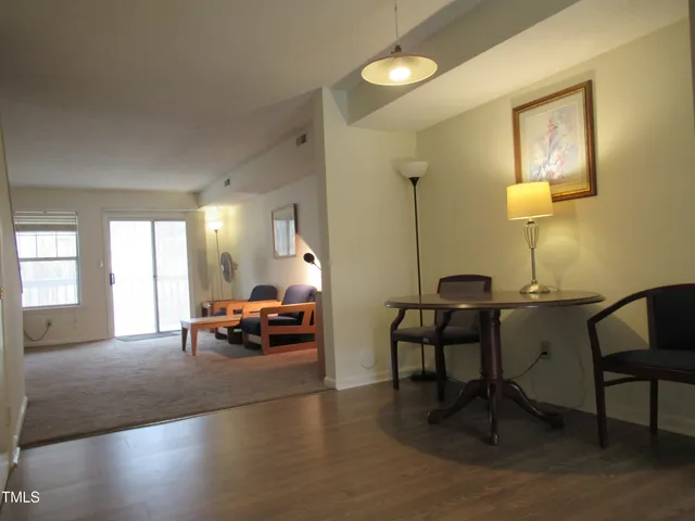 a living room with furniture and a table